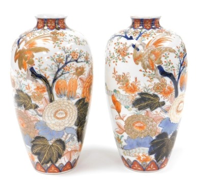 A pair of Meiji period Japanese porcelain Fukugawa vases, of shouldered tapering form, decorated with birds, blossom, and flowers, orchid mark of the Fukugawa Company to base, 22cm high.