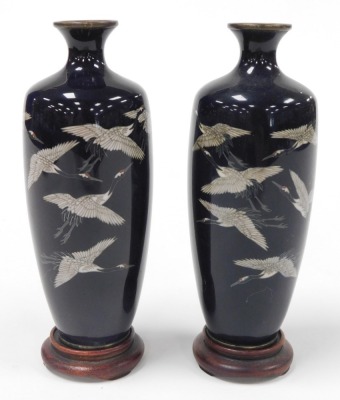 A pair of Japanese Meiji period silver wire cloisonne vases, on stands, of shouldered tapering form, decorated with birds on a dark blue ground, 15cm high. - 2