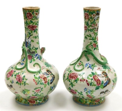 A pair of late 19thC Qing dynasty Cantonese famille rose pottery vases, of long necked bulbous form, moulded with chilin (baby dragons) and decorated with butterflies and flowers, 29cm high. - 3