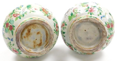 A pair of late 19thC Qing dynasty Cantonese famille rose pottery vases, of long necked bulbous form, moulded with chilin (baby dragons) and decorated with butterflies and flowers, 29cm high. - 6