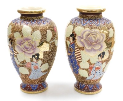 A pair of 20thC Japanese Satsuma vases, of baluster form, decorated with ladies in a garden with oversized flowers, on a brown ground, signed, 32cm high. - 2