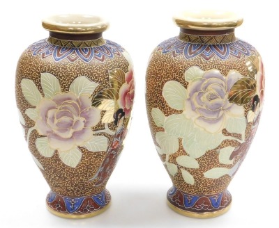 A pair of 20thC Japanese Satsuma vases, of baluster form, decorated with ladies in a garden with oversized flowers, on a brown ground, signed, 32cm high. - 4