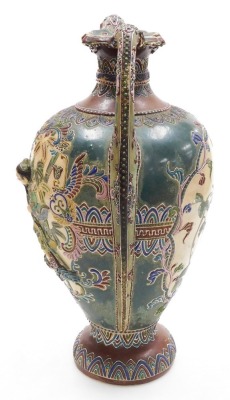 A Japanese Satsuma twin handled vase, decorated to the obverse in bas-relief with a figure in a boat, amongst bamboo, verso a reserve with flowers, Japanese numeral to the base, 43cm high. - 2