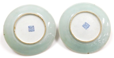 Four 19thC Chinese celadon and famille rose porcelain plates, decorated with birds, butterflies, and flowers, 19.5cm wide, a further plate, 21cm wide, and a smaller plate, 18.5cm wide. (6) - 7