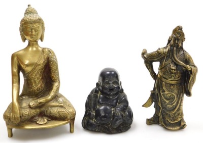 A group of Chinese brassware, including a pair of lion dog candlesticks, a dragon teapot, a four faces of Buddha bust paperweight, and figures of deities, together with a Tibetan figure of a seated Buddha, etc. (a quantity) - 2