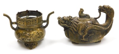 A group of Chinese brassware, including a pair of lion dog candlesticks, a dragon teapot, a four faces of Buddha bust paperweight, and figures of deities, together with a Tibetan figure of a seated Buddha, etc. (a quantity) - 11