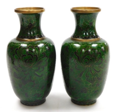 A pair of Chinese green cloisonne enamel vases, decorated with flowers, 21cm high, and a similar ginger jar and cover, 9.5cm high. (3) - 4