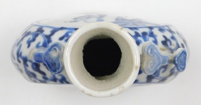 A Qing dynasty blue and white porcelain moon flask, decorated centrally with figures in a garden within a floral ground, Qianlong four character mark, 15cm high. - 5