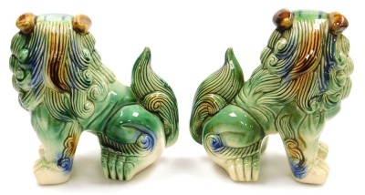 A pair of Chinese green glazed dogs of fo, modelled facing left and right in seated pose, 21cm wide. - 3