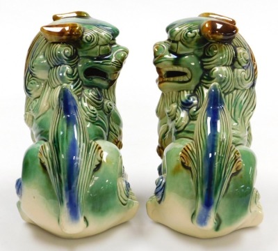 A pair of Chinese green glazed dogs of fo, modelled facing left and right in seated pose, 21cm wide. - 4