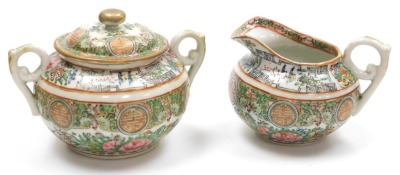 A 20thC Cantonese famille rose porcelain tea service, decorated with birds, butterflies and flowers, printed red China mark, comprising; teapot, sucrier, cream jug, sugar or slop bowl, pair of bread plates, eleven tea cups, nine saucers, and twelve tea pl - 8