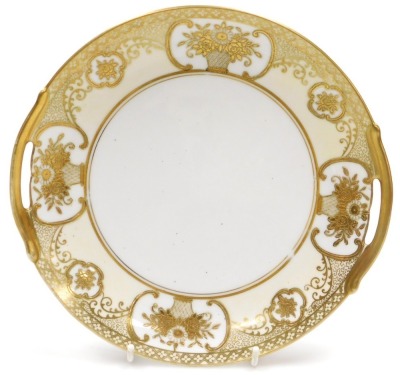 An early 20thC Noritake porcelain tea service, gilt decorated with flowers and foliate scrolls, on a pale yellow ground, comprising a pair of bread plates, cream, sugar bowl, twelve teacups, saucers, and tea plates. - 2