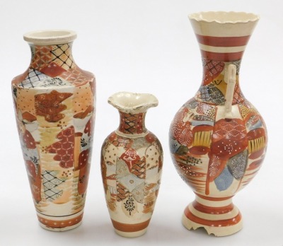 A 20thC Japanese Satsuma vase, of shouldered tapering form, decorated wit figures in a garden, 30cm high, a twin handled vase of baluster form, decorated with figures, 34cm high, and a further Satsuma vase, 22cm high. (3) - 4