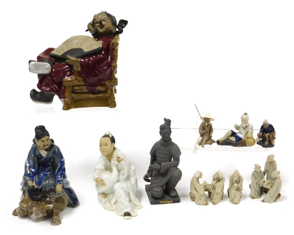 A group of Chinese mudmen and other figures, including deities ...