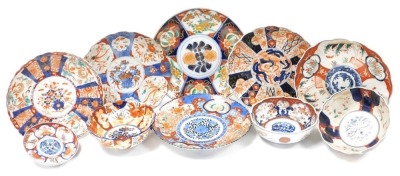 A group of Japanese Imari bowls, plates and dishes, Meiji period. (a quantity)