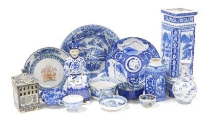 A group of Oriental blue and white pottery and porcelain, including tea wares, vases, seated figure of an emperor, bowls, and a candle holder. (a quantity)