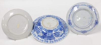 A group of Oriental blue and white pottery and porcelain, including tea wares, vases, seated figure of an emperor, bowls, and a candle holder. (a quantity) - 3