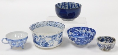 A group of Oriental blue and white pottery and porcelain, including tea wares, vases, seated figure of an emperor, bowls, and a candle holder. (a quantity) - 4