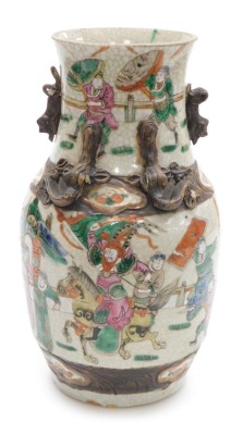 A19thC Nanjing crackle glaze vase, moulded with lizards and decorated with warriors and other figures, incised seal mark to base, 29.5cm high. (AF)