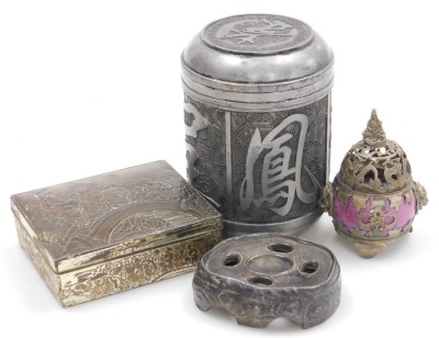 A Chinese white metal tea canister, of cylindrical form, 13cm high, an antimony box, decorated in relief with figures on a bridge, an incense burner, and a metal stand. (4)