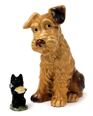 A Sylvac pottery figure of terrier, in seated pose, no. 1380, impress marks, 28cm high, together with a Beswick Beatrix Potter figure modelled as Duchess, with pie, printed marks. (2)