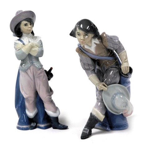 A Lladro porcelain figure of a cavalier, model seated, no. 6119, and a further figure of a standing cavalier, no. 6118, printed and impress marks. (2)