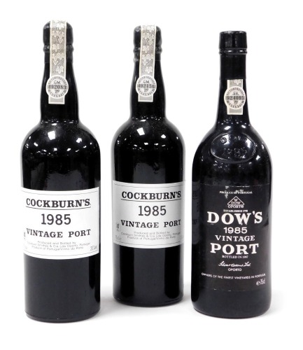 Two bottles of Cockburn's vintage port 1985, together with a bottle of Dow's vintage port 1985. (3)