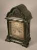 A 19thC ebonised mantel clock in gothic style