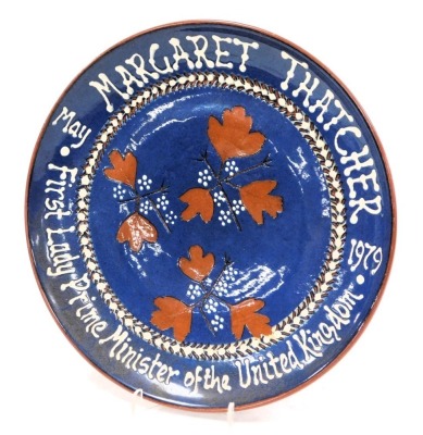 A commemorative wall plate from Yeo pottery, to Margaret Thatcher from the Cleveland Ladies Conservative Association in commemoration of her being the first lady Prime Minister of the United Kingdom, 26cm diameter.