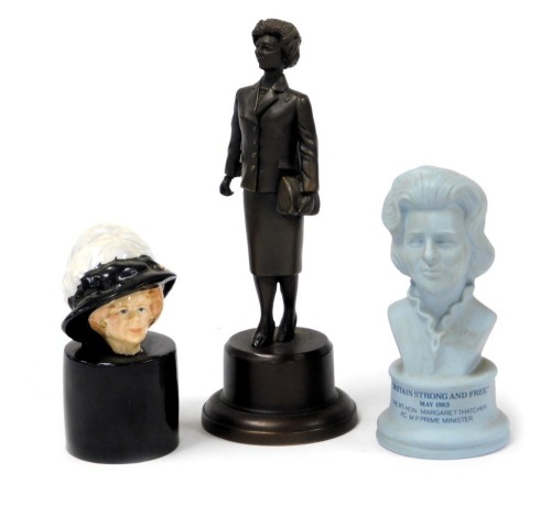 A bronze figure of Margaret Thatcher, approx 18cm high, another smaller bust of Margaret Thatcher by Royal Doulton, and another smaller ceramic bust of Margaret Thatcher.