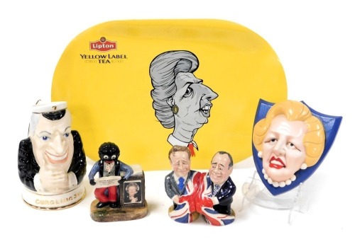 Collectables, including an Edward Heath glug jug, a wall plaque with Margaret Thatcher's face, two Bear Stone Manor collectables, one of Alex Hammond and one of David Cameron, and a golly with a Golly Gazette, Margaret Thatcher The End of an Era, along wi