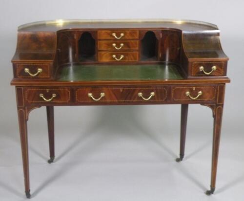 A reproduction mahogany and checker banded Carlton House desk with a raised gallery above fitted dra