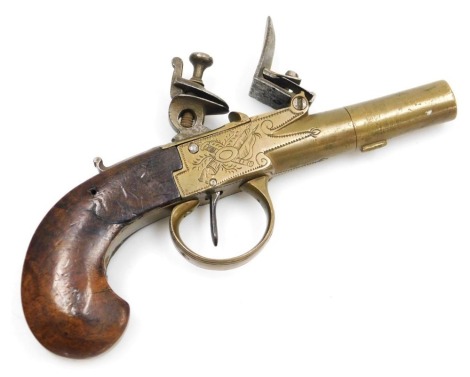 A Continental flint lock box lock brass pistol, c1800, the box engraved with symbols of war, with a walnut stock, 16cm long.