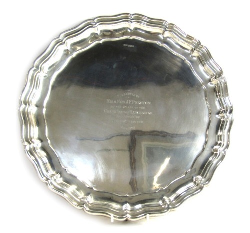 A George V silver salver, of circular form with piecrust border, raised on three scroll cast feet, presentation engraved to 'Mr & Mrs J F Preston by The Staff of The Grand Hotel Manchester, As a Token of Respect and Esteem, July 1939', Sheffield 1938, 43