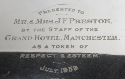 A George V silver salver, of circular form with piecrust border, raised on three scroll cast feet, presentation engraved to 'Mr & Mrs J F Preston by The Staff of The Grand Hotel Manchester, As a Token of Respect and Esteem, July 1939', Sheffield 1938, 43 - 2