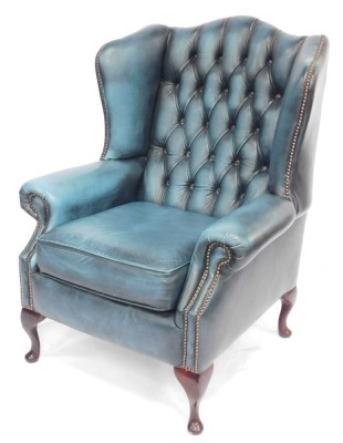 A Saxon button back wingback two seater sofa, with stud work, raised on four cabriole legs, with pad feet, 130cm wide, together with a matching wingback armchair. - 3