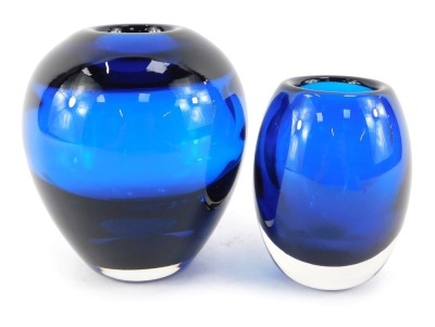 A Whitefriars blue glass vase, of ovoid tapering form, pattern number 9584, 14cm high, together with a Whitefriars small ovoid blue glass vase designed by Jeffrey Baxter, possibly 1950s, pattern number 9581, 11cm high.