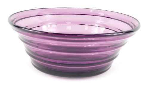 A Whitefriars aubergine coloured glass bowl, of tapering ribbed form, pattern number 9054, 22cm diameter.