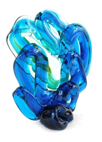 A Mdina glass sculpture, modelled as a knot, in blue with flashes of yellow, indistinctly signed to underside, 21cm high.