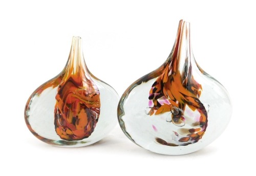 Two Isle of Wight glass 'Lollipop' vases, in mottled orange, black and red, interior swirls, one bearing label, 15cm and 13cm high respectively.