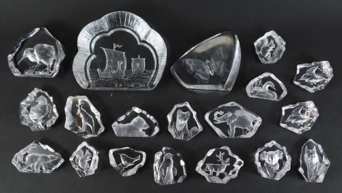 A group of Mats Jonasson glass paperweights, varying designs, to include elephant, kiwi bird, butterfly, squirrel, fox cub, together with a Nybro Swedish paperweight, decorated with two Viking long boats, 12cm high.