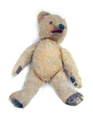 A 1950s mohair Teddy Bear, with felt pads and opposable arms and legs, 30cm high.