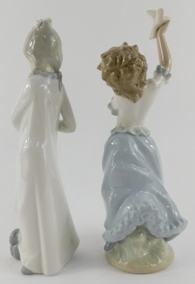 Two Nao porcelain figures, modelled as a young girl with dog, and a young girl holding dove, painted marks, each 25cm high. - 2