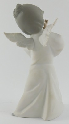 A Lladro matt porcelain figure, modelled as an angel, printed marks, 23cm high. - 2