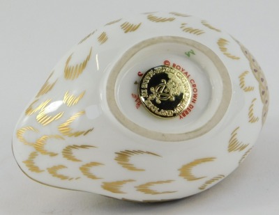 A Royal Crown Derby porcelain paperweight, modelled as a dappled quail, gold stopper, red printed marks, 6.5cm high. - 3