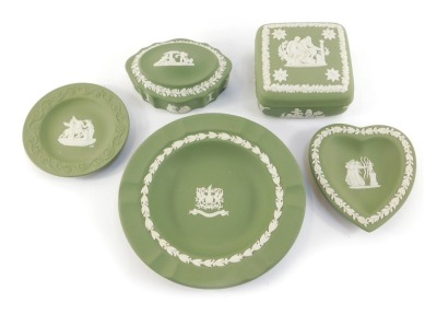 A group of green Wedgwood jasperware, comprising two trinket boxes and covers, heart shaped trinket dish, circular trinket dish and plate. (5)