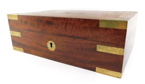 A 19thC mahogany and brass bound Campaign writing slope, the hinged lid enclosing two recesses and a velvet upper section, 11cm high, 33cm wide, 22cm deep.