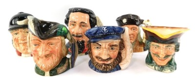 Five Royal Doulton character jugs, comprising Robin Hood D6534, Charles Dickens D6901, Gone Away D6538, Christopher Columbus D6911, a Highwayman, and a further pottery character jug. (6)