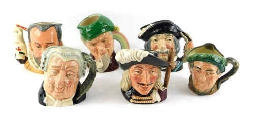 Six Royal Doulton character jugs, comprising Aramis D6454, Sancho Panza, The Lawyer D6504, King Philip II of Spain D6822, Old Mae, and Leprechaun.