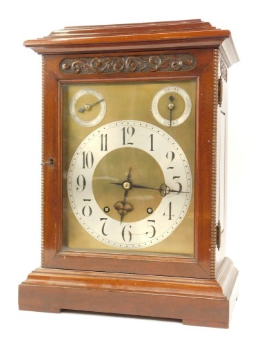 A late 19thC German mahogany bracket clock by Winterhalder & Hofmeier, with pierced fret back, and a brass and silvered numeric dial with thirty hour chiming movement, with floral spandrels, 43cm high, 31cm wide, 20cm deep.